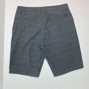 Gray striped Volcom shorts.